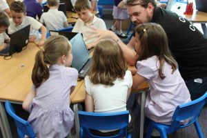 Girls coding workshop with coach