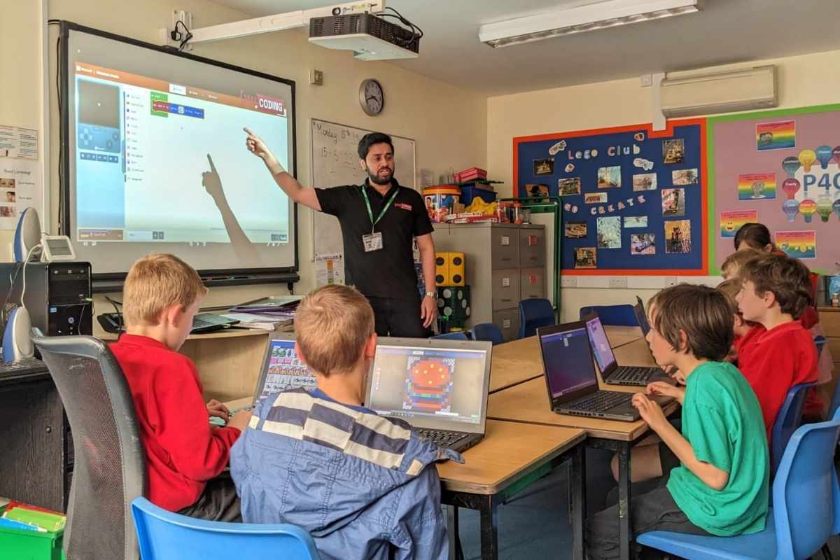Children taking part in jam coding holiday club