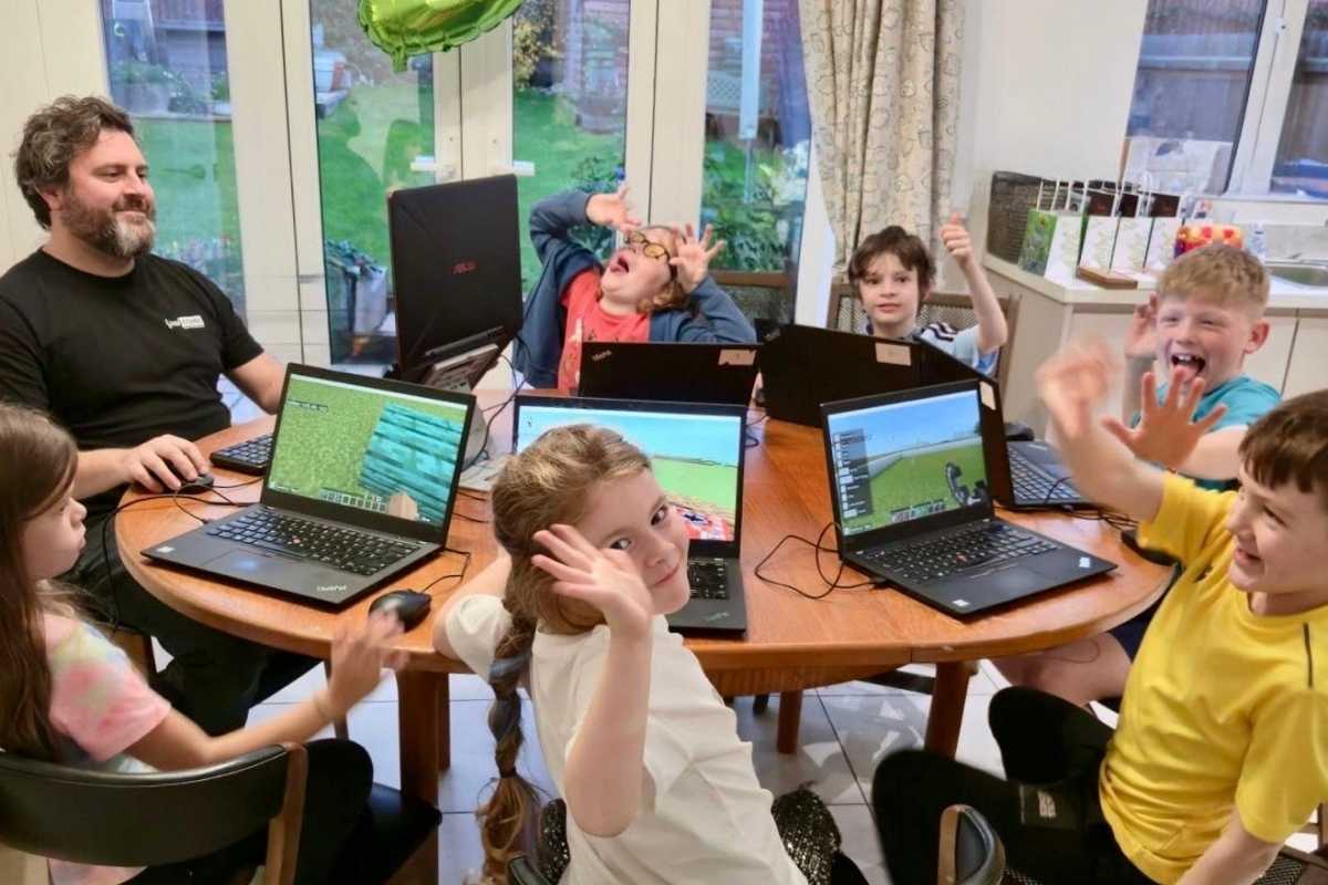 Children playing minecraft during birthday party